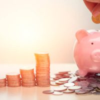 Hand Saving Money concept, Piggy bank with coin for Wealth Income and Profit Financial Business Grow